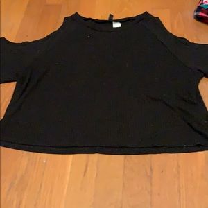 Off the shoulder black loose shirt.